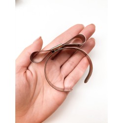 BRACCIALE A FORMA DI FIOCCO IN METALLO BRACCIALE A FORMA DI FIOCCO IN METALLO